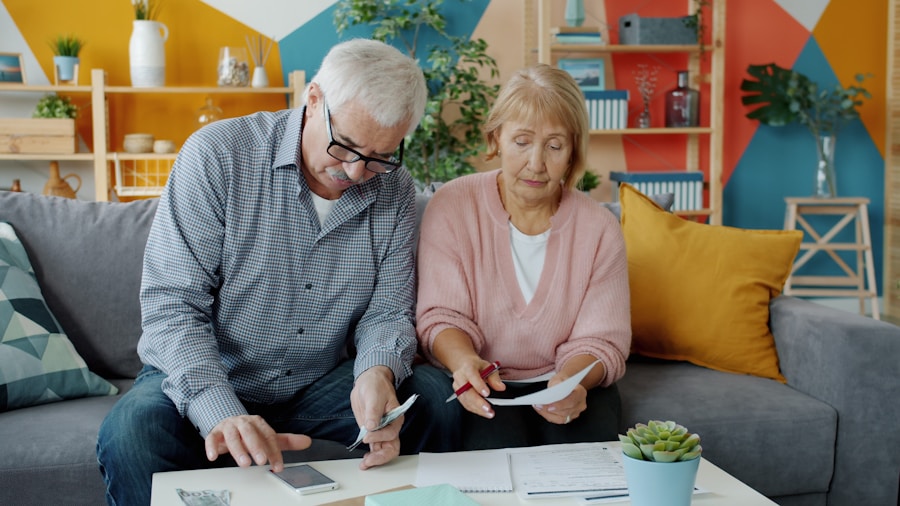 Mature couple reviewing financial documents together in a bright home